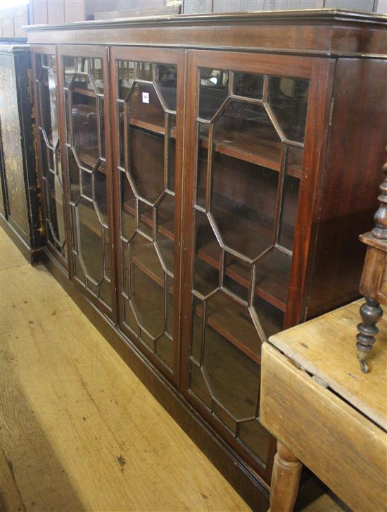 An Edwardian mahogany four door bookcase, W.7ft